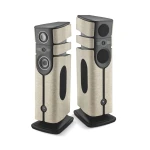 Pair of tall floor-standing speakers with beige fabric grilles and dark gray enclosures on black bases, shown side by side.