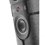 Close-up of a speaker showing a red mesh tweeter and a large woofer set in a gray cabinet with surrounding fabric panels.
