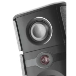 Close-up of a black speaker showing a circular woofer and a small tweeter grille area.