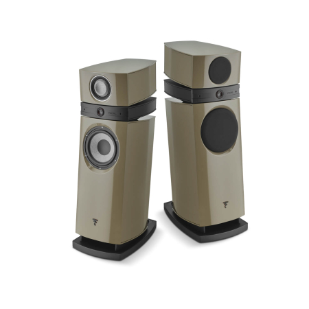 Pair of beige floor-standing speakers with black drivers, set on curved black bases and shown side by side.