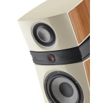 Close-up of a beige, wood-panel floor-standing speaker showing a large woofer and a smaller tweeter area (brand: FOCAL).